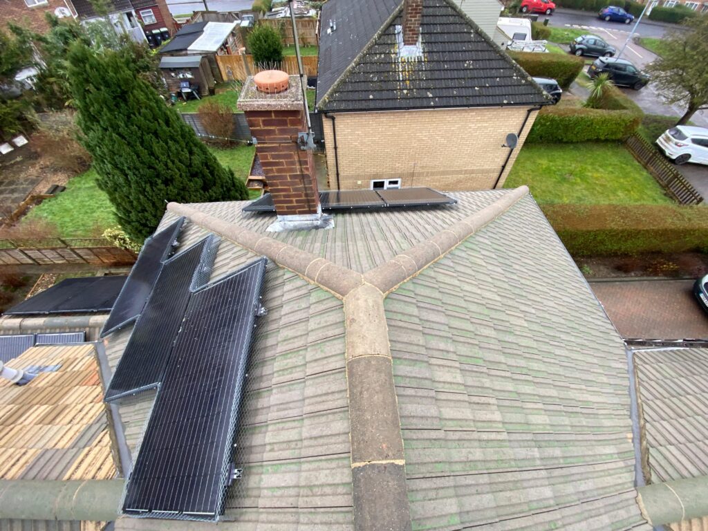 Professional roof cleaning service in West London removing moss and dirt
