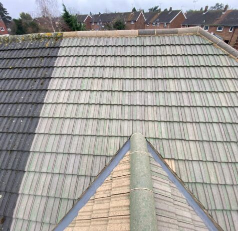 Professional roof cleaning service in West London removing moss and dirt