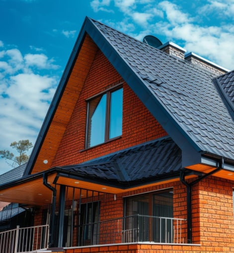 Applying a protective roof coating to extend the lifespan of tiles in West London, United Kingdom.