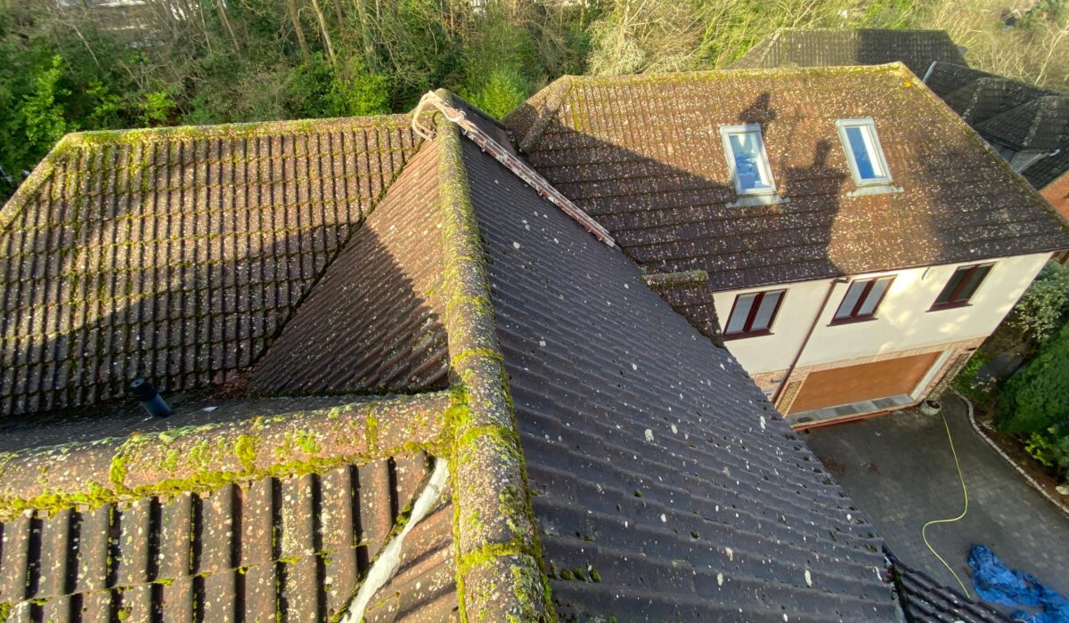 Waterproof roof sealing service preventing future moss growth on a cleaned roof in London, UK.