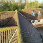 Waterproof roof sealing service preventing future moss growth on a cleaned roof in London, UK.