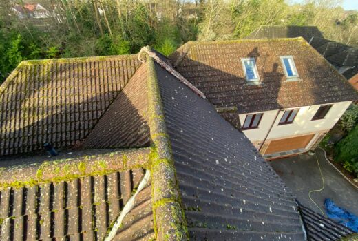 Waterproof roof sealing service preventing future moss growth on a cleaned roof in London, UK.